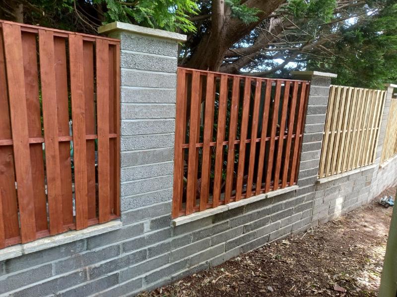 Block wall with fence panels