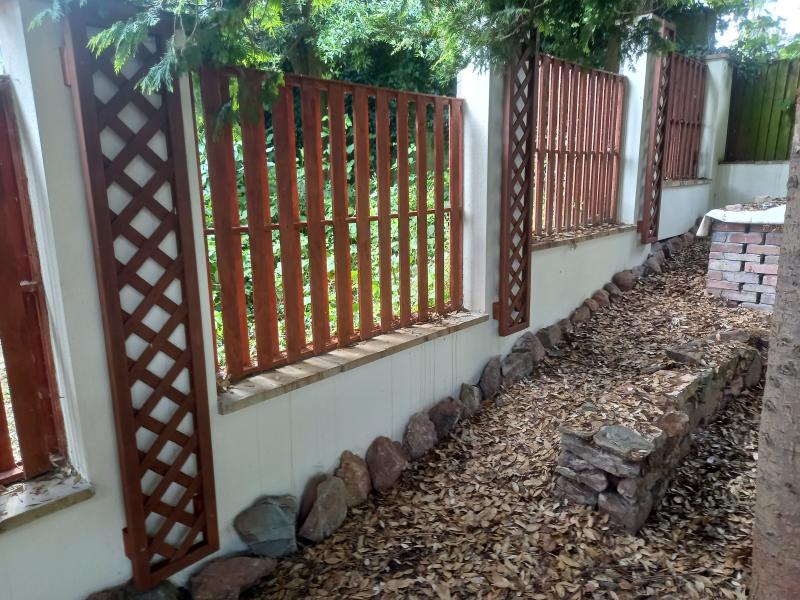 A blockwork wall with attached gate
