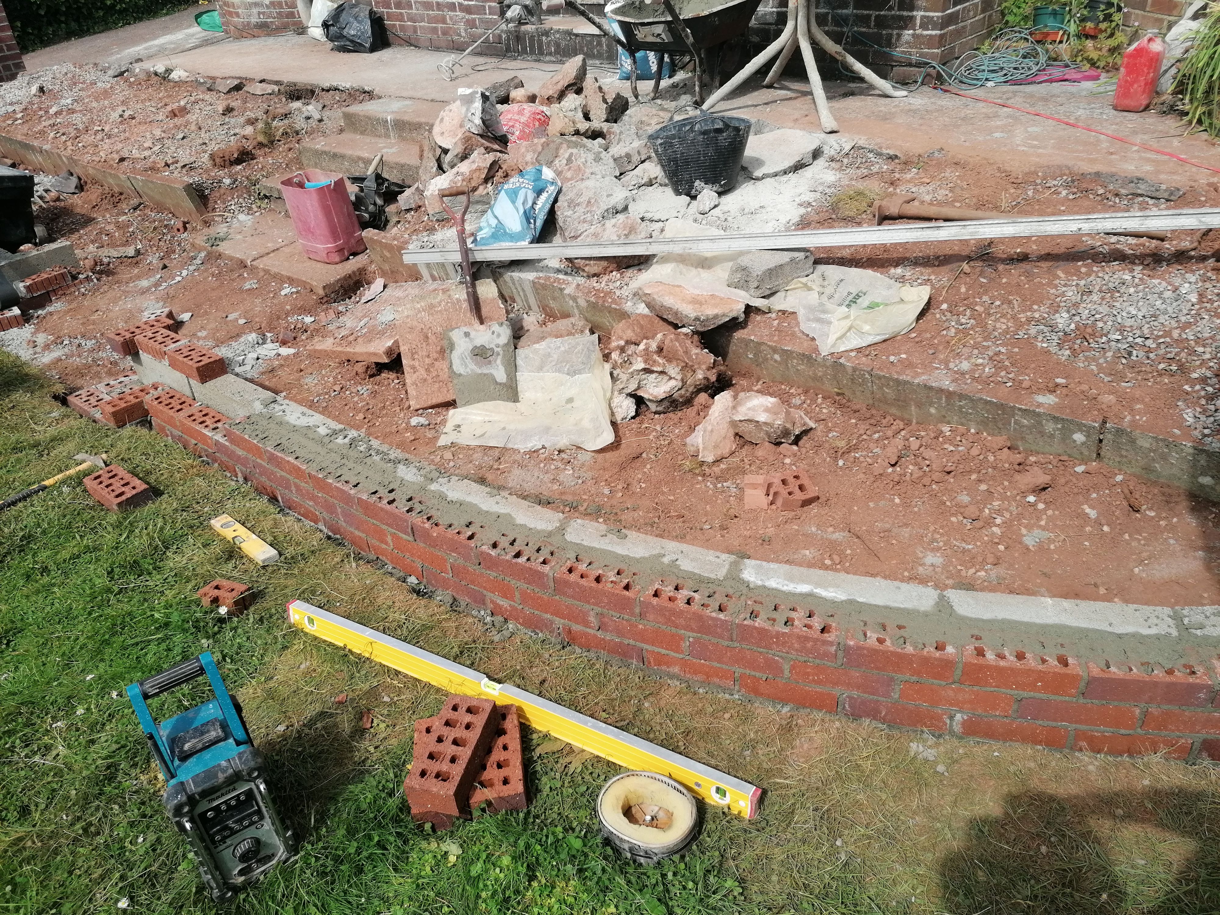 The first courses of a curved brickwork wall