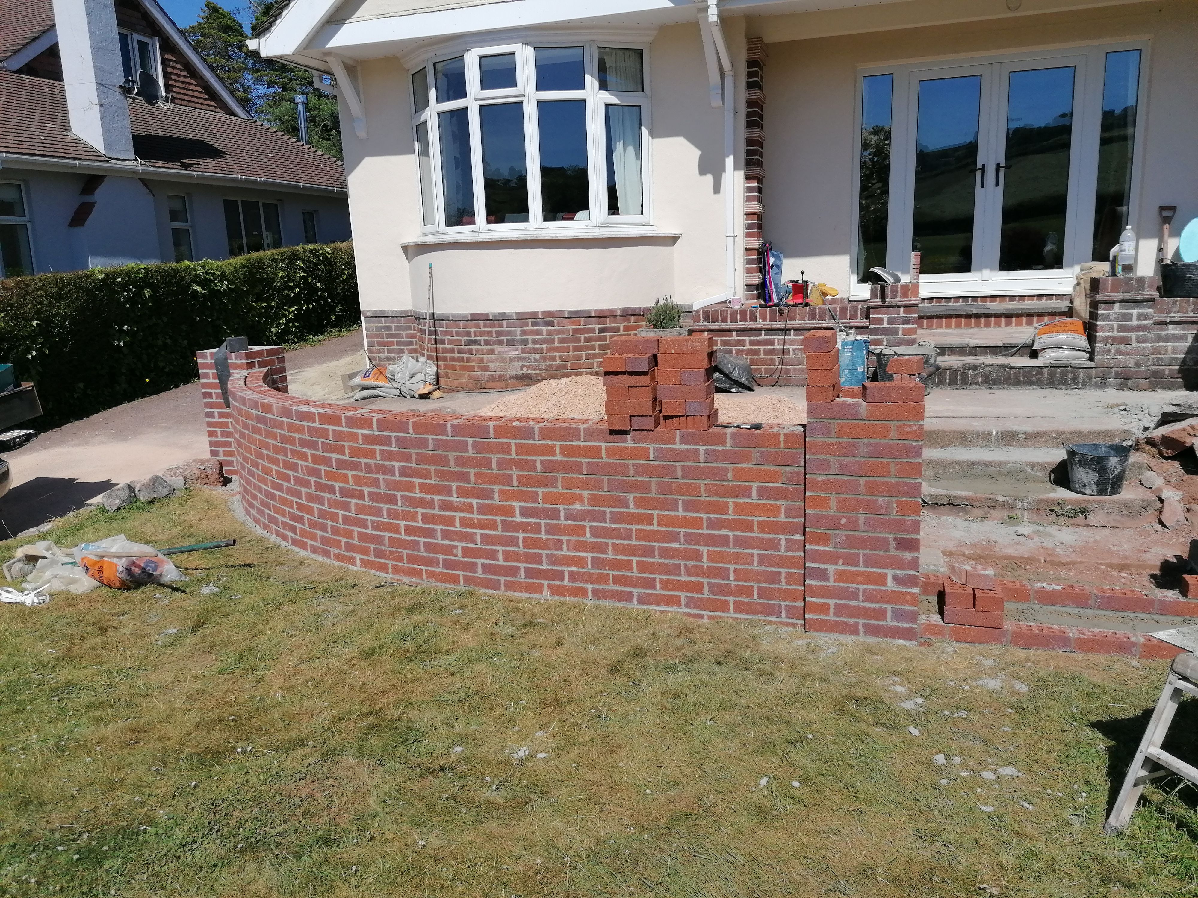Wall being built up plumb and starting the steps