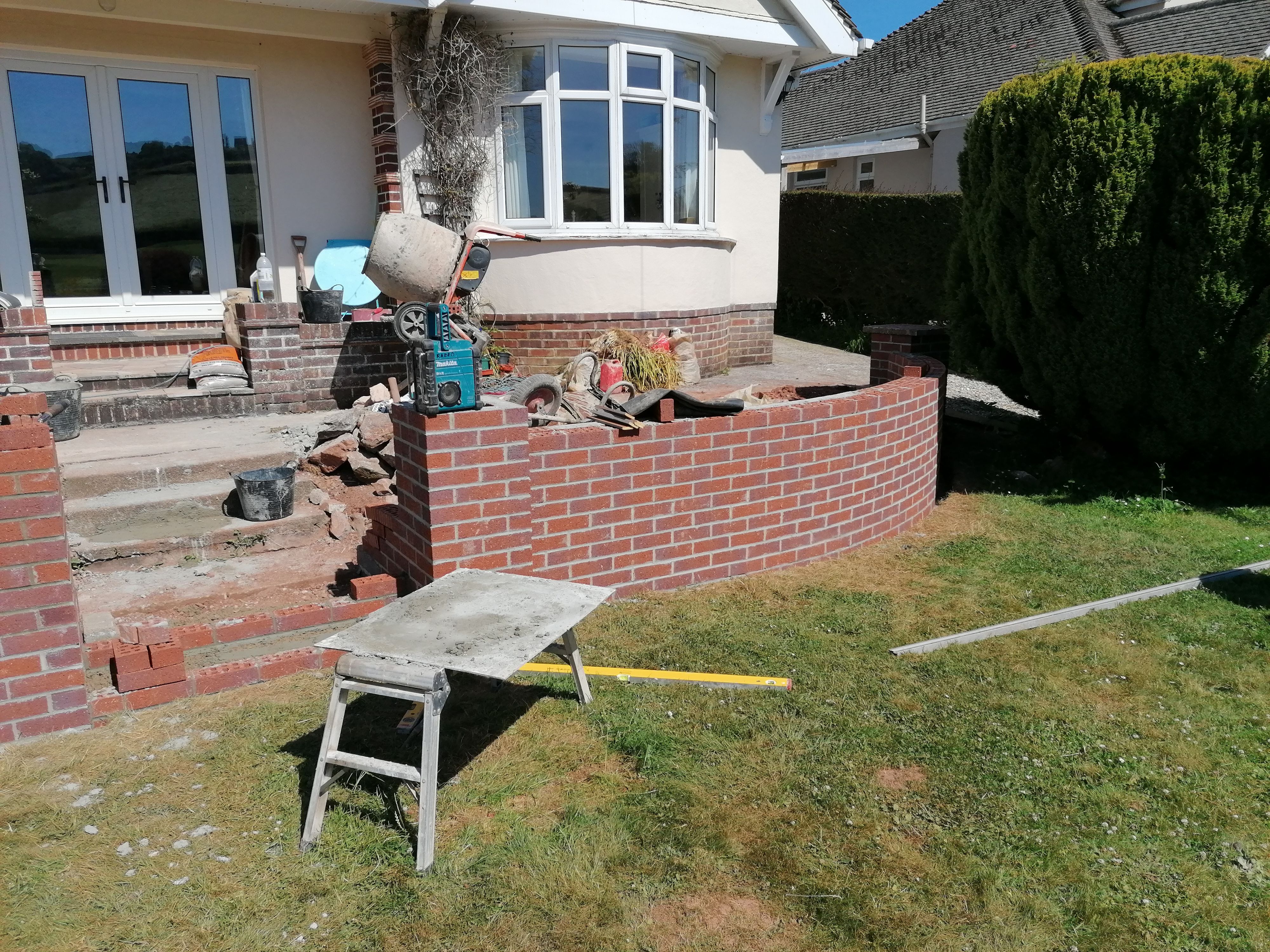 Wall being built up plumb and starting the steps