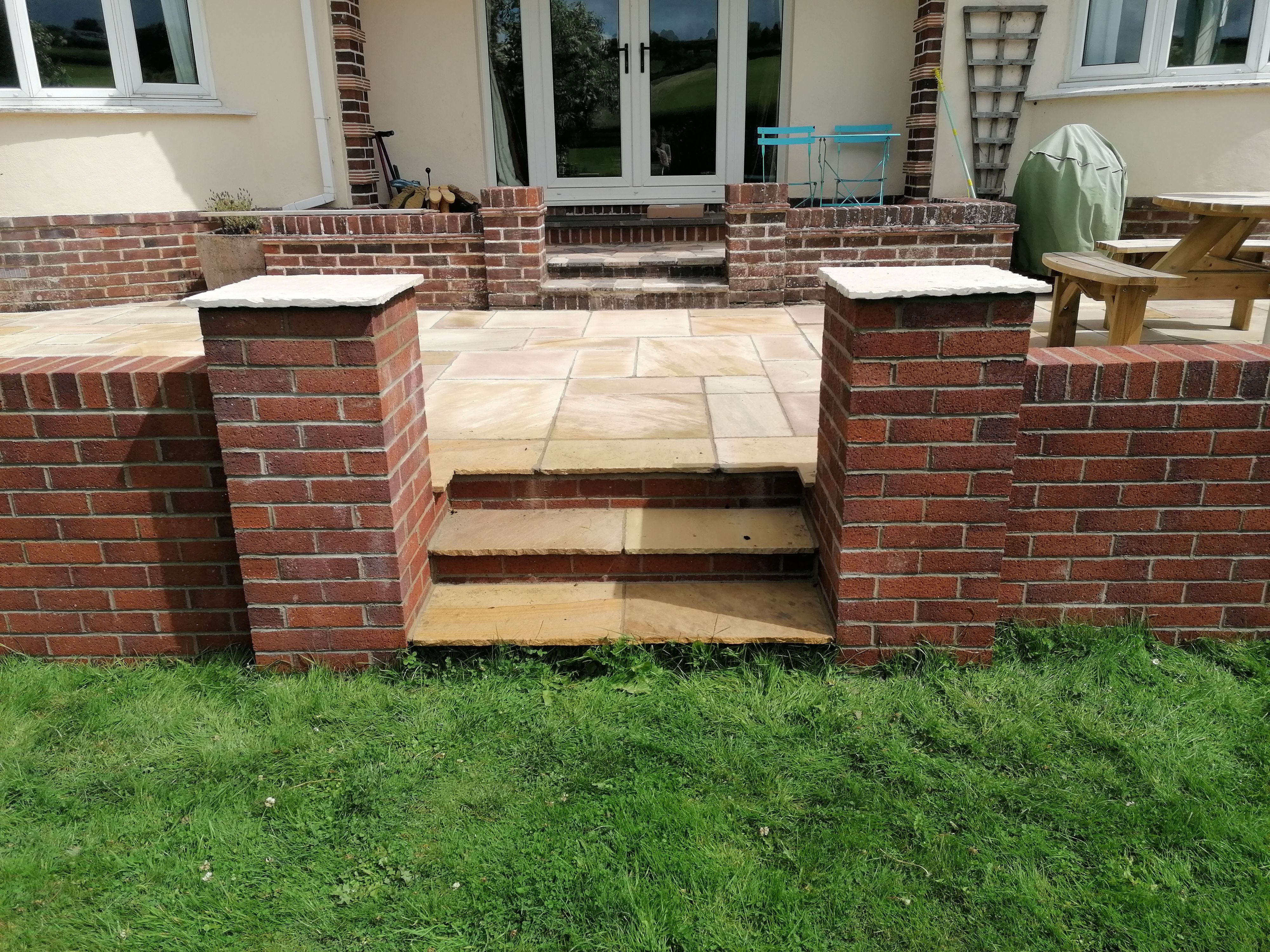 Brickwork stairs flanked by brickwork piers