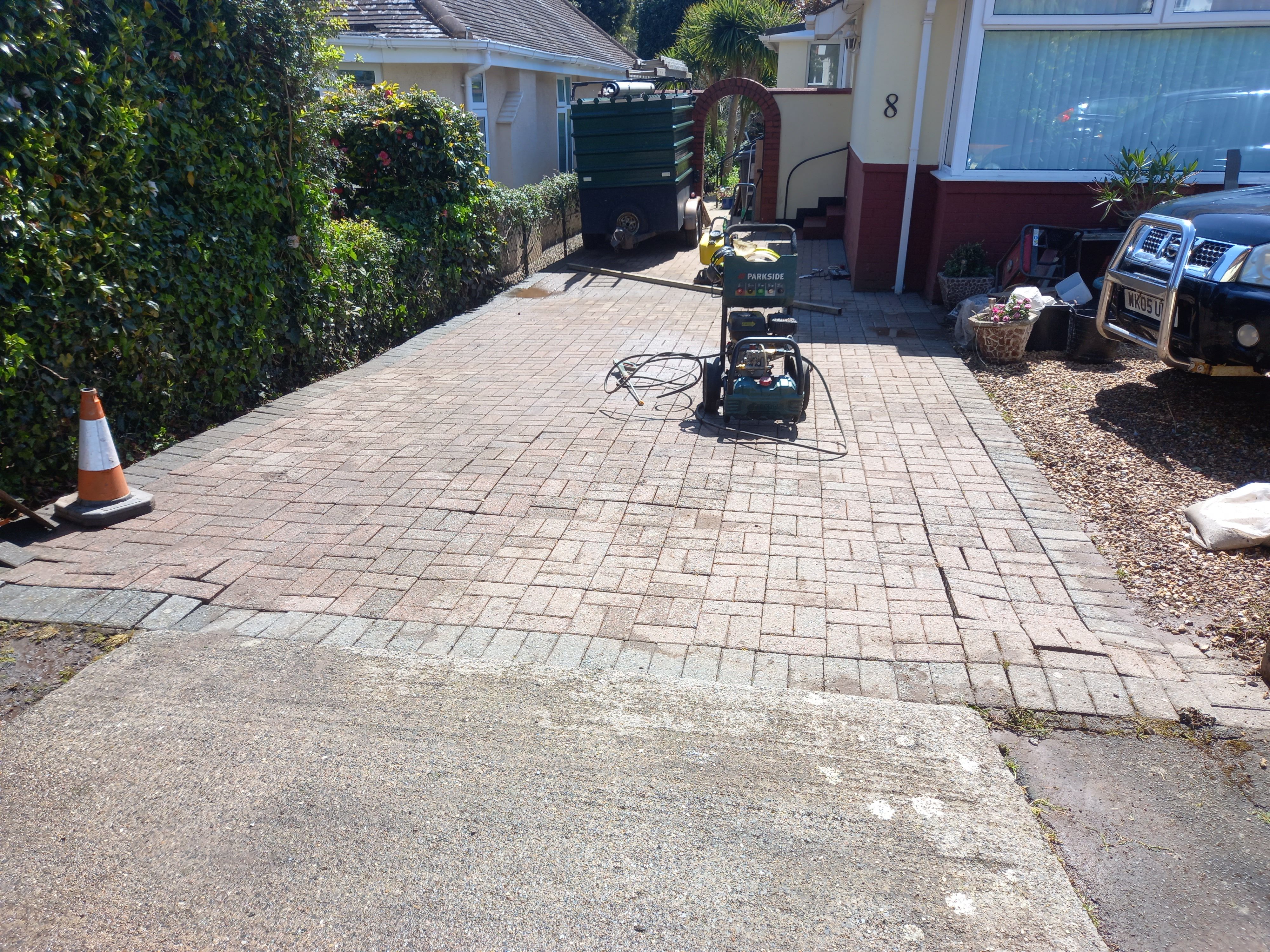 A jetwashed driveway with uneven pavers